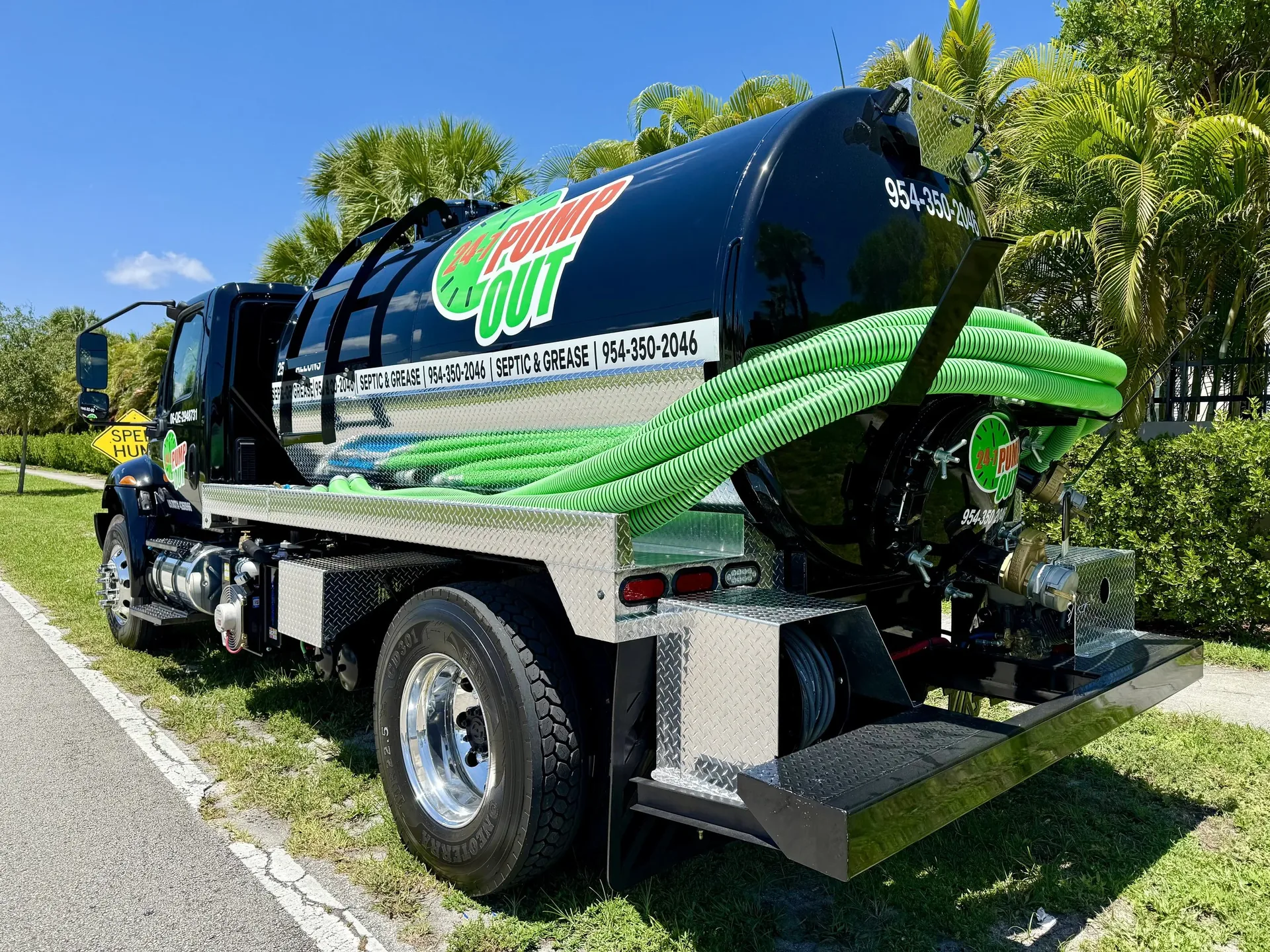 The 24-7 Pump Out vacuum tank truck loaded with hoses
